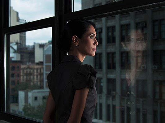 Trader looking out a window